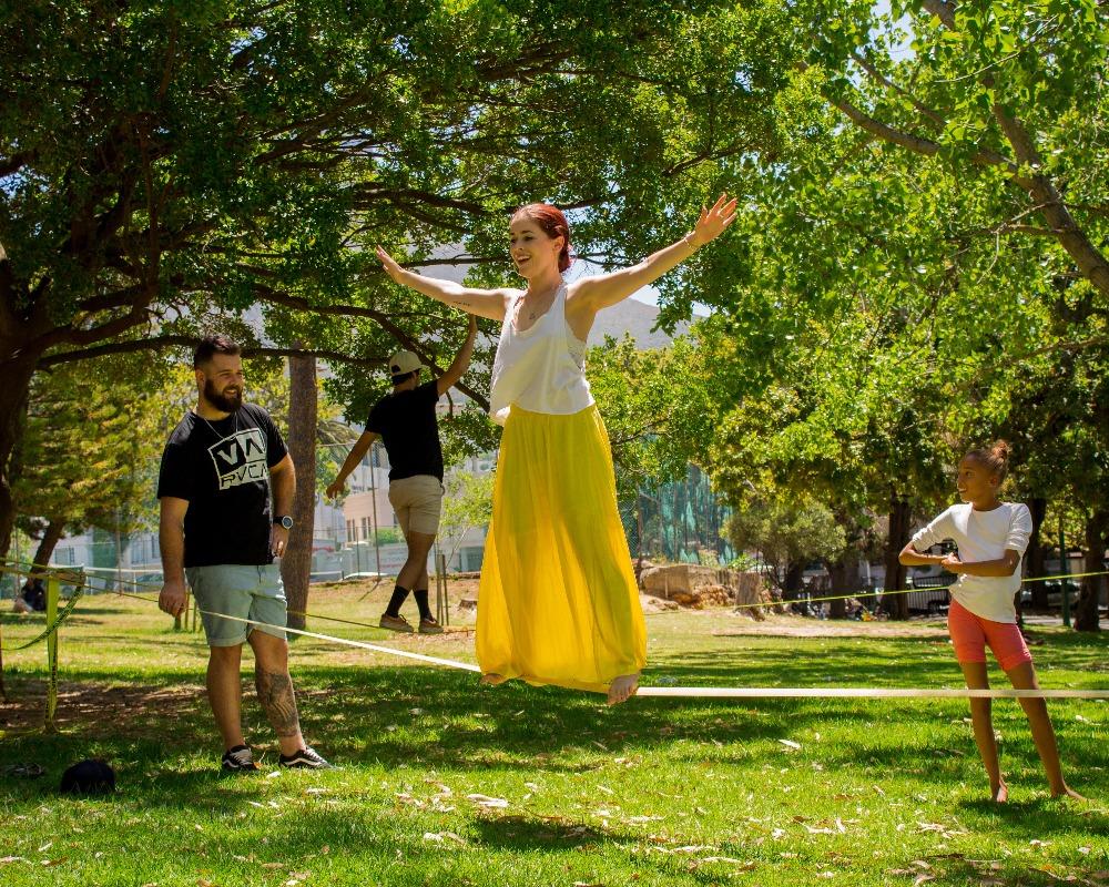 Slacklining on a beginner viper slackline in de waal park in cape town south africa