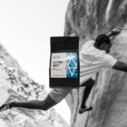 rock climbing using 'Clutch Dust' chalk